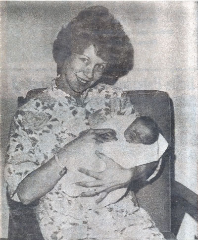 In this photo from the Brookings Register, Lynne Omar poses with her daughter, Vickie, the first baby born at the new Brookings Hospital location in 1964.