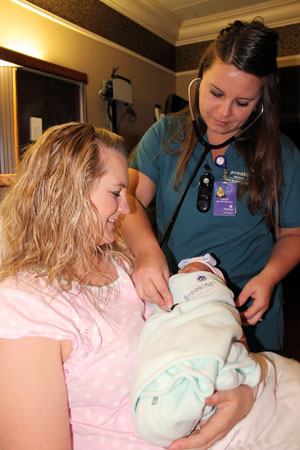 Obstetrics Nurse Lacy Maher, RN, listens to the heartbeat of newborn, Elsie, one of the twin daughters born to Stacy and Tyler Knutson of Toronto, S.D. Both Elsie and her twin sister, Evelyn, roomed-in with their mother during their stay at Brookings Health System. Rooming-in is one of the seven care dimensions measured by the CDC’s mPINC survey of infant nutrition practices. Baby-Friendly practices like rooming-in led to Brookings Health System’s recent high score on the mPINC survey.