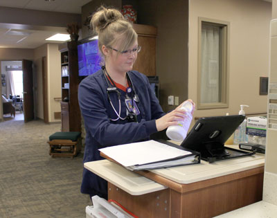 Nursing Supervisor Crysta Lingscheit, RN, prepares resident medications on the Oak Lane/Birch Way neighborhood at The Neighborhoods at Brookview nursing home. The Neighborhoods most recent survey conducted by the South Dakota Department of Health resulted in zero deficiencies cited. State surveyors examine all areas of nursing home care, including quality measures, charting and care plans, making it challenging for facilities to receive a deficiency-free survey.