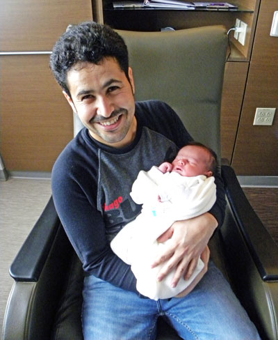 Proud father Emad Sari holds his newborn son, Hussein, who was born at 5:02 a.m. this morning, making him the first baby born in 2019 at Brookings Hospital.
