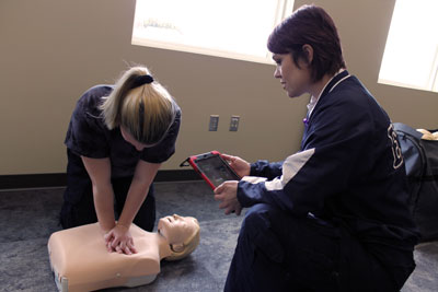 Paramedic Wendy Long, a certified American Heart Association CPR instructor, helps a student practice chest compressions on a QCPR manikin in the new Ambulance Station and Education Center’s classroom. Brookings Health will hold the first CPR class for the public at the new Ambulance Station and Education Center on March 7. The course will use the new QCPR classroom technology to provide instructors information on student performance and reassure students they are executing high-quality CPR techniques.