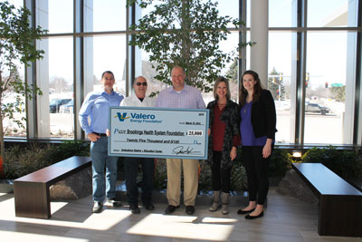 Employees from the Valero Aurora Ethanol Plant present a $25,000 check from the Valero Energy Foundation to Brookings Health System Foundation in support of the new Ambulance Station and Education Center which recently opened along Yorkshire Drive. Pictured from left to right are Valero Plant Manager Brian Brinkman, Ambulance Director Gordon Dekkenga, Valero Manager Supply Chain Execution Jay Ryan, Valero Office Coordinator Angela Koch and Brookings Health System Foundation Director Sara Schneider.