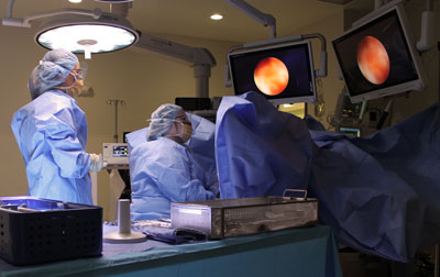 Gynecologist Dr. Kirstin Sholes performing a surgical procedure in Brookings Hospital's operating room