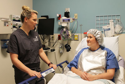 Gynecologist Dr. Tara Haarsma meets with a patient in same-day surgery prior to a procedure