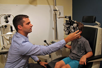 Optometrist Dr. Taylor Kneip performs a routine patient examination at Yorkshire Eye Clinic & Optical to assess for visual correction needs and overall eye health. The new optometrist has family roots in Brookings and recently joined the practice with Ophthalmologists Dr. Kenneth Knudtson and Dr. Timothy Minton. Together Kneip and his colleagues offer comprehensive vision services including routine eye care, medical eye care and corrective optical products.