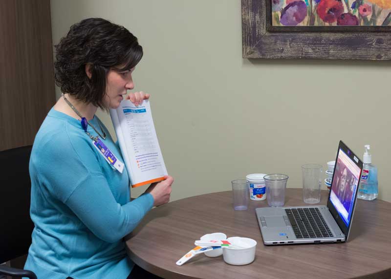 Dietitian talking with patient about diabetes over a telehealth visit on the computer