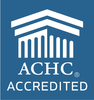 Blue and white ACHC Accredited logo featuring the cap of a Grecian column with the name below it