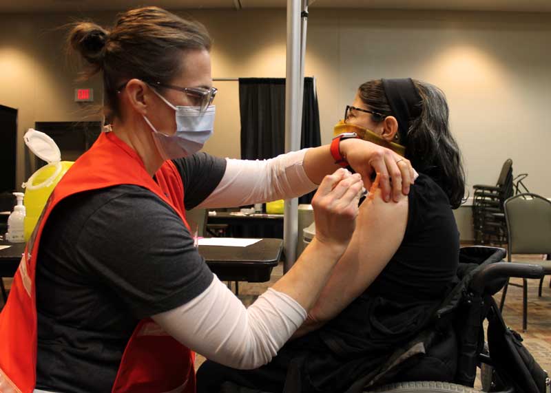 Melissa Bonvallet receives her first COVID-19 vaccine dose from Kelsey Stoltenberg, LPN, at the community vaccination center held on March 11. The Brookings County PPCC will hold two additional community vaccination centers on April 1 and April 15 at the Swiftel Center for eligible individuals in Phase 1D and Phase 1E of the South Dakota Department of Health’s vaccination plan. Qualified people may sign up by calling (605) 692-2811 or by visiting brookingshealth.org/POD.