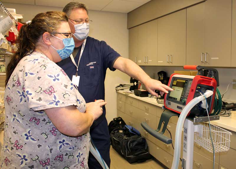 Respiratory Therapist Sarah Wesdorp follows instructions from trainer David Brouwer while learning how to use the new transport ventilator. The portable, mechanical device helps either invasive or non-invasive patients who need airway assistance to breathe when being moved. The ventilator’s advanced capabilities enables Brookings Health’s ambulance team to now quickly and safely transfer a non-invasive patient to another facility.