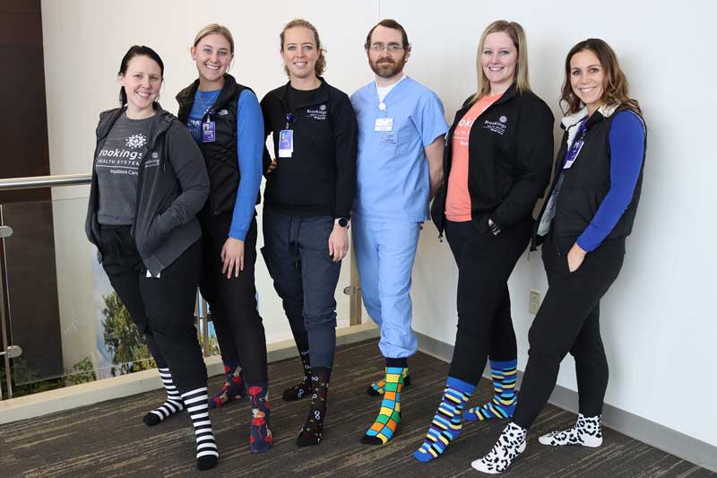 Brookings Health System’s Wound Center is encouraging the community to donate socks this February during the “Every Sole Deserves a Sock” drive. Showing off their colorful socks in encouragement are the wound center’s team. Pictured from left: Wound Care Nurse Jaclyn Nielsen, RN; Program Director Reghan Boldt, MOT, OTR-L, CLT; Wound Care Nurse Erica Sanderson, RN; Podiatrist Dr. Nephi Jones, DPM; Health Unit Coordinator Amber Norton; and Nurse Practitioner Katie Jones, CNP. New pairs of socks can be dropped off at Brookings Health System’s main campus. Donations will be given to The Salvation Army of Brookings.