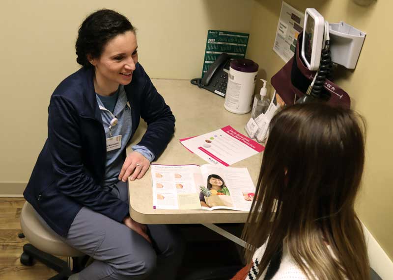 General Surgeon Dr. Sara Marroquin, M.D., discusses types of breast abnormalities with a patient at the Avera Medical Group Specialty Care Clinic. Marroquin and the same-day surgery team at Brookings Health System will now perform breast conserving surgery, also known as lumpectomy, for local patients diagnosed with early-stage breast cancer. The newly acquired SAVI SCOUT surgical guidance system will help Marroquin and the team save healthy breast tissue, maintaining a more natural appearance for patients.