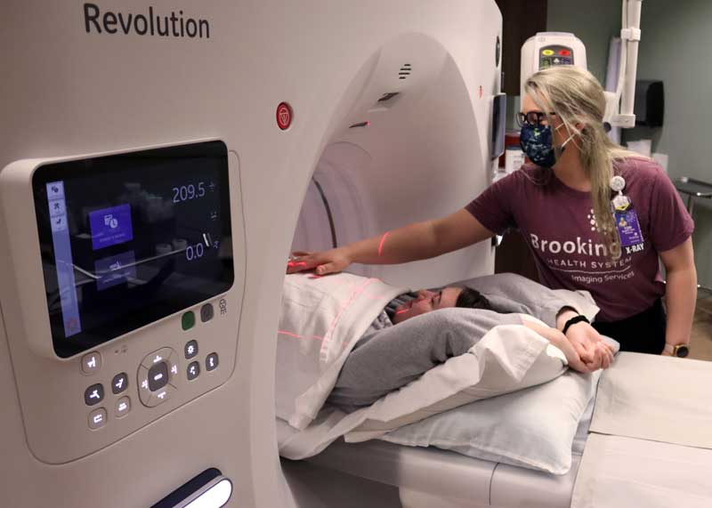 CT Technologist Tori Arzdorf prepares a patient before performing an abdominal anatomy scan at Brookings Health’s radiology department. Brookings Health System’s new CT system uses low dose radiation and artificial intelligence to create high-resolution images with enhanced contrast, texture and detail. The CT system also streamlines and automates workflow, allowing Brookings Health to get test results more quickly to medical providers for interpretation.