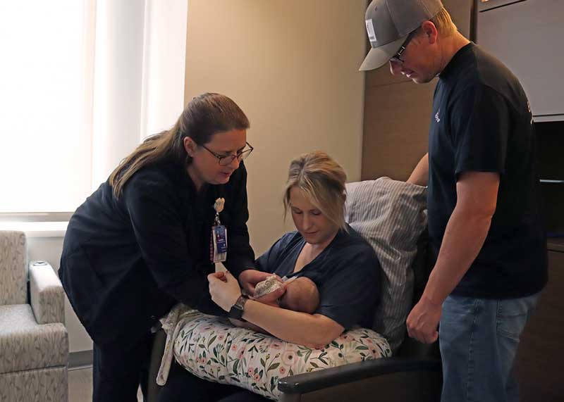 Obstetrics Nurse Audra Heidenreich, RN, helps new parents Lacey and Ky Ribstein of Volga position their daughter, Lennon, before initiating breastfeeding. Brookings Health System again scored 100 of 100 points on the CDC’s most recent mPINC survey that rates infant feeding practices in maternity care settings. As a Baby-Friendly designated hospital, Brookings Health has implemented many of the CDC’s recommended hospital care practices that encourages mothers to breastfeed infants.