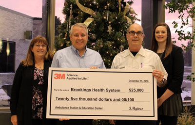 Mary Erickson, 3M Brookings administrative coordinator, and Dale Tidemann, 3M Brookings plant manager, present a $25,000 3M Capital Investments 2018 grant to Ambulance Director Gordon Dekkenga and Foundation Director Sara Schneider. The 3M grant supports Brookings Health System Foundation’s capital fundraising campaign to help build the new Ambulance Station and Education Center located along Yorkshire Drive.