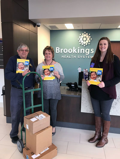 Larry Janssen of the Brookings Rotary Club delivered the first copies of, “The Brain Game: Fun Ways to Help Your Baby’s Mind Grow,” to Brookings Hospital’s obstetrics unit. Each baby born in 2019 at Brookings Hospital will receive a copy of the booklet thanks to a grant to Brookings Health System Foundation received from the Brookings Rotary. Pictured with Janssen are Obstetrics Director Mary Schwaegerl and Foundation Director Sara Schneider.
