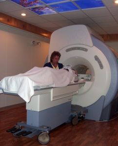 MRI technologist Mary Jane Foster assists a patient before a MRI scan. Brookings Health System recently upgraded the facility's MRI software to make patient scans quicker and more detailed.
