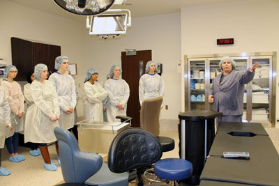 Terri Stauffacher, OR Registered Nurse, teaches students from Brookings High School’s HOSA Chapter about the new OR in Brookings Health System. The OR was one of the five stops on their tour of the expanded Brookings Hospital.