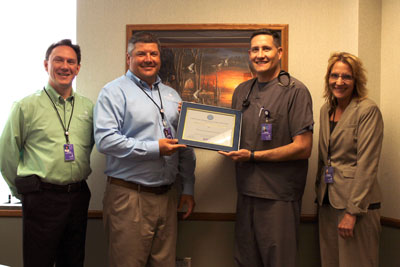 Brookings Health System recently received the Above and Beyond Award from the Employer Support of the Guard and Reserve. Lieutenant Colonel Dave Fossum, physician assistant at Brookings Health, nominated the health system in recognition for surpassing the legal requirements of USERRA. Pictured from left to right are Chief Financial Officer Steve Lindemann, CEO Jason Merkley, Fossum, and Chief Nursing Officer Tammy Hillestad.