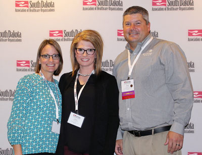 Emergency Department Nurse Chelsey Sundberg, RN, was honored last week at the 91st annual SDAHO convention with the Distinguished Service Award in the Young Professional category. She was recognized for her demonstrated leadership in both her military and civilian careers. Pictured from left to right: Medical Surgical and Emergency Department Director Karen Weber, Sundberg, and CEO Jason Merkley.