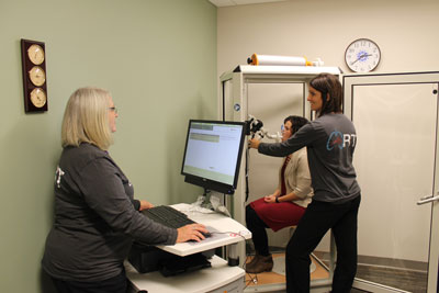 Respiratory Therapists Janie Isham (left) and Meredith Meyer practice administering pulmonary plethysmograph testing with fellow employee Katy VanderWal. Commonly referred to as a body box, the pulmonary plethysmograph helps diagnose patients with pulmonary conditions, such as asthma, chronic obstructive pulmonary disease and other breathing conditions. The new equipment allows patients to receive advanced testing in Brookings, saving local patients time and travel expenses.