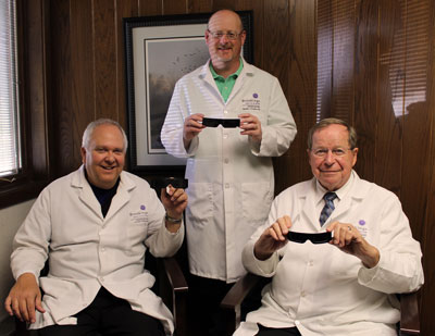 Dr. Timothy Minton, Dr. Kenneth Knudtson and Dr. Ronold Tesch, ophthalmologists at Yorkshire Eye Clinic, show eclipse glasses with specially designed solar filters that allow people to safely view a solar eclipse. Yorkshire Eye Clinic is currently giving away eclipse glasses so area residents can safely view the upcoming Aug. 21 solar eclipse.
