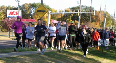 Participants from last year’s Community Wellness 5K Fun Run-Walk begin the race from across the Hy-Vee parking lot.