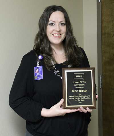 Becky Cermak, speech-language pathologist at Brookings Health System, was recently presented the Honors of the Association from the South Dakota Speech-Language-Hearing Association (SDSLHA). Cermak received the recognition for advocating the South Dakota legislature to pass a bill to require universal licensure of all speech-language pathologists.