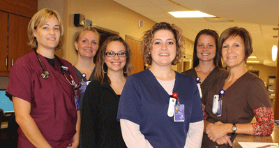 Brookings Health System’s hospital was recently named one of the 2014 America’s Best Hospitals for Emergency Care by WomenCertified, Inc. The selection is based on how quickly patients are seen by care providers and how much time they spend in the emergency department. Pictured here is part of the emergency department staff, from left, Physician Assistant Tara Heinze, RN Heather Bortnem, Receptionist Ashley Sumner, RN Jen Chandler, RN Devan Hoekman and ED Supervisor RN Bev Cotton.