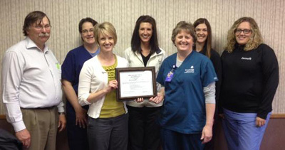 Brookings Health System has completed Phase 2 of four phases in the Baby-Friendly accreditation process. With the certificate indicating completion of the Development phase, from left to right, are the Baby Friendly team: Dr. Richard Gudvangen, RN Suzanne Smidt, Dr. Shelby Eischens, RN Mandy Olson, RN Mary Schwaegerl, RN Cindy Pejsa and Dr. Ellen Hopper. Not pictured: Dr. Sarah Smith, RN Aleycia Gerlach and RN Sara Klug.